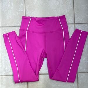 Victoria's Secret Essential Pocket Leggings in Berry Pink with white piping.